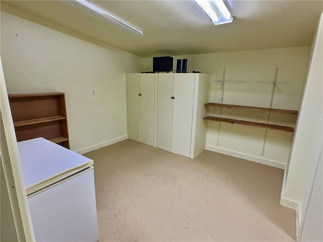 426 Van Buren, Eureka Springs, AR 72632 - interior space featuring white refrigerator and baseboards