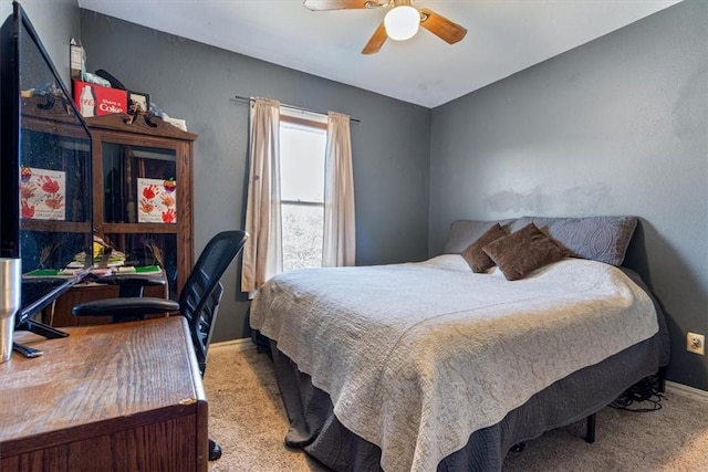 bedroom featuring ceiling fan, carpet flooring, and baseboards