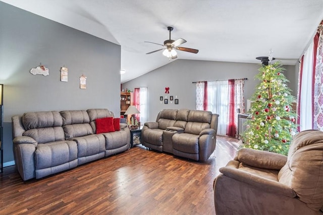 living room with a ceiling fan, lofted ceiling, and wood finished floors