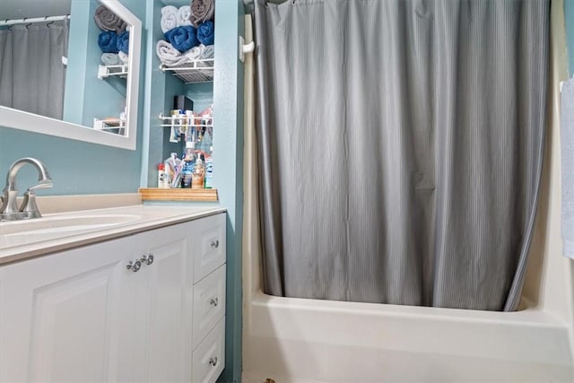 bathroom with shower / bathtub combination with curtain and vanity