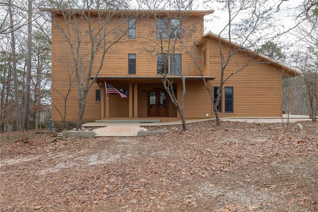 back of property featuring a porch