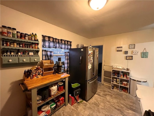 kitchen featuring stainless steel refrigerator