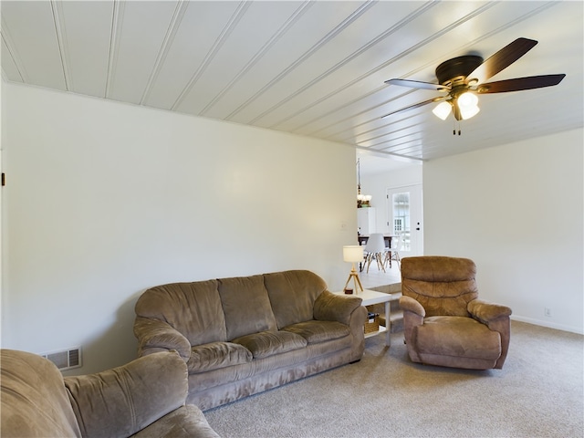 living room with carpet flooring and ceiling fan