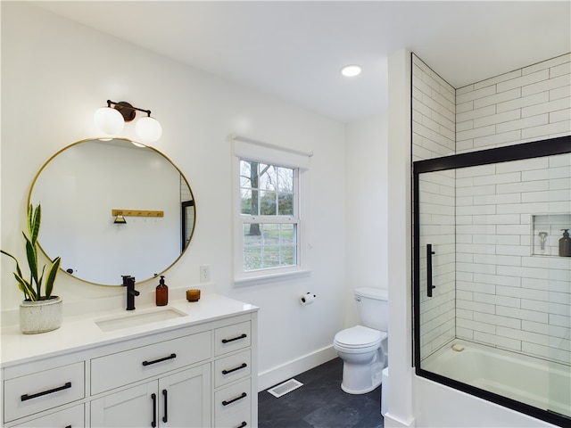 full bathroom with vanity, toilet, and bath / shower combo with glass door