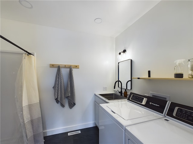 laundry area featuring sink and independent washer and dryer