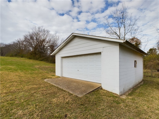 garage featuring a yard