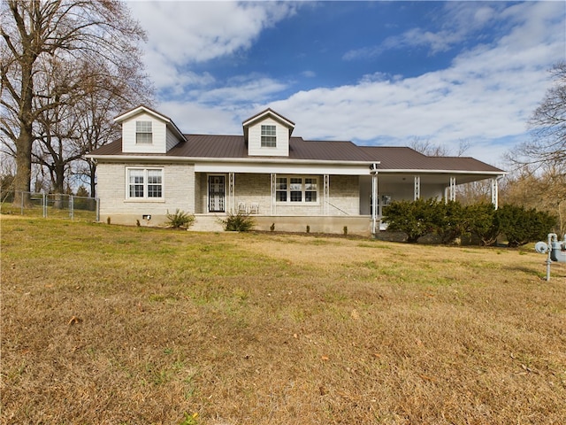 cape cod home featuring covered porch and a front yard