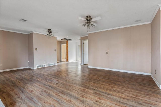 spare room featuring hardwood / wood-style floors, a textured ceiling, ceiling fan, and crown molding