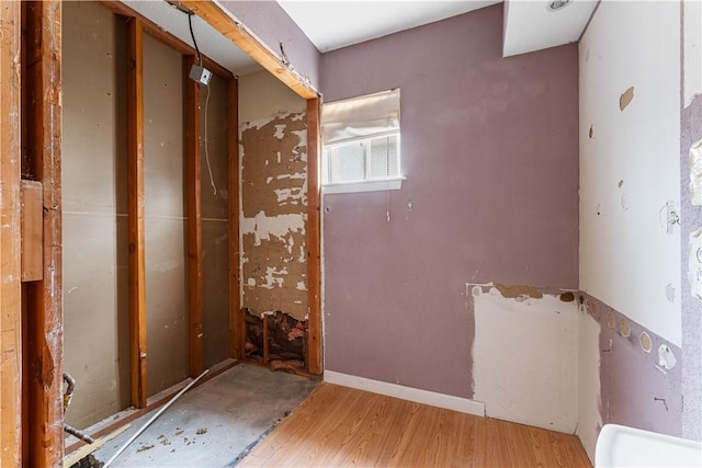 bathroom with hardwood / wood-style floors