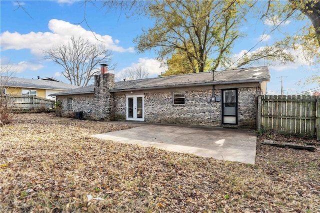 back of house with french doors, a patio area, and central air condition unit