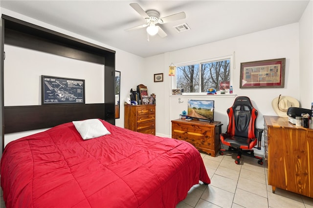 bedroom with ceiling fan and light tile patterned floors