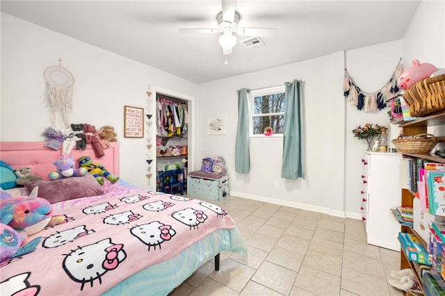 tiled bedroom featuring ceiling fan