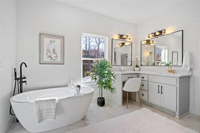 8893 Williams Rd, Rogers, AR 72756 - bathroom with vanity, marble look tile flooring, and a freestanding bath