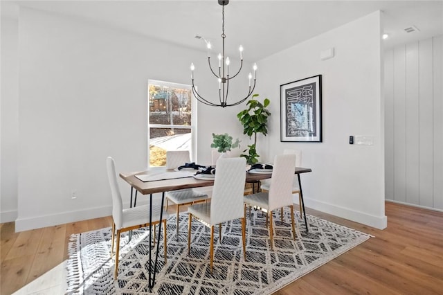 8893 Williams Rd, Rogers, AR 72756 - dining room with light wood-type flooring and a chandelier