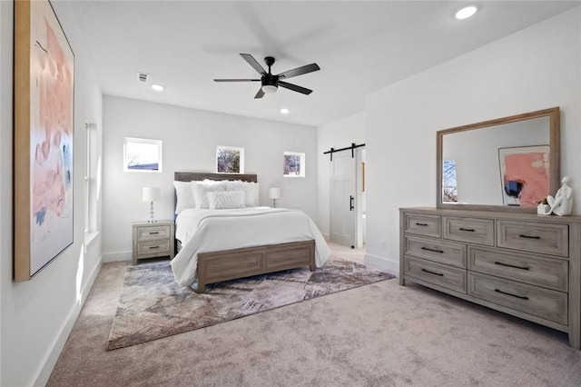 8893 Williams Rd, Rogers, AR 72756 - carpeted bedroom with a barn door, recessed lighting, and ceiling fan
