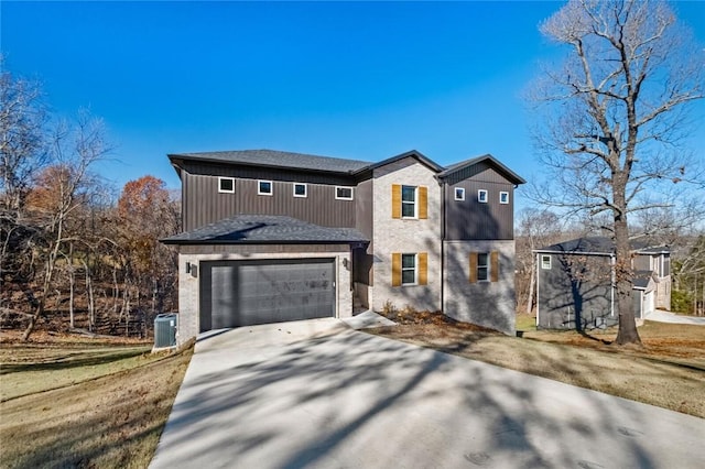 view of property featuring a garage and central AC