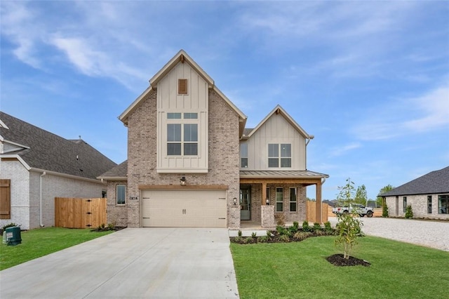 445 Fox Trl, Elm Springs, AR 72762 - view of front of home with board and batten siding, a front yard, driveway, and brick siding