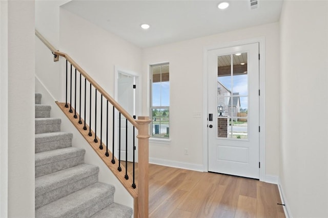 445 Fox Trl, Elm Springs, AR 72762 - foyer entrance with visible vents, baseboards, stairway, recessed lighting, and light wood finished floors