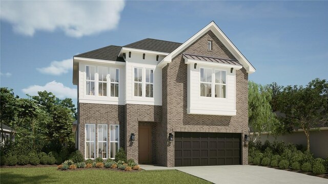 view of front of home with a garage and a front yard