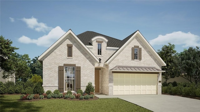 view of front of house featuring a garage and a front lawn