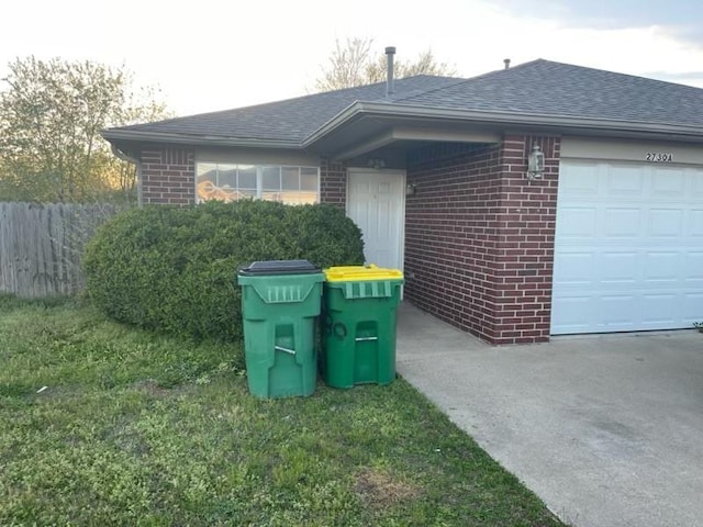 view of side of property with a garage