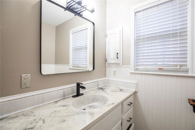 bathroom featuring vanity and plenty of natural light