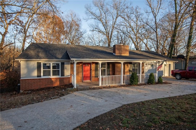 ranch-style house with a garage and a porch