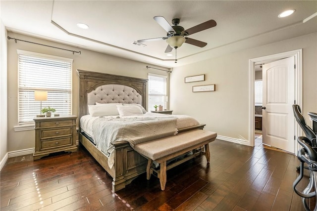 bedroom featuring dark hardwood / wood-style flooring and ceiling fan