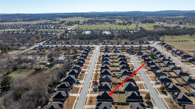 birds eye view of property with a mountain view