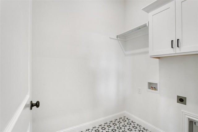 435 Fox Trl, Elm Springs, AR 72762 - laundry room with hookup for an electric dryer, cabinet space, baseboards, and hookup for a washing machine