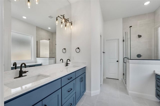 435 Fox Trl, Elm Springs, AR 72762 - full bath with double vanity, a shower stall, tile patterned flooring, baseboards, and recessed lighting