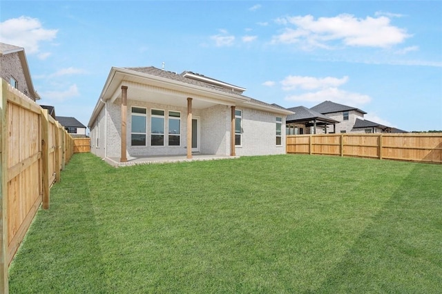 435 Fox Trl, Elm Springs, AR 72762 - rear view of property featuring brick siding, a gazebo, and a patio