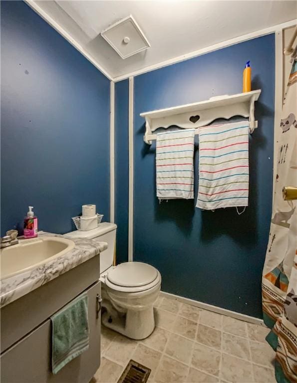 bathroom featuring vanity and toilet