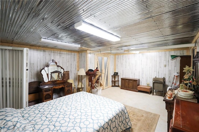 bedroom with wood ceiling and wood walls