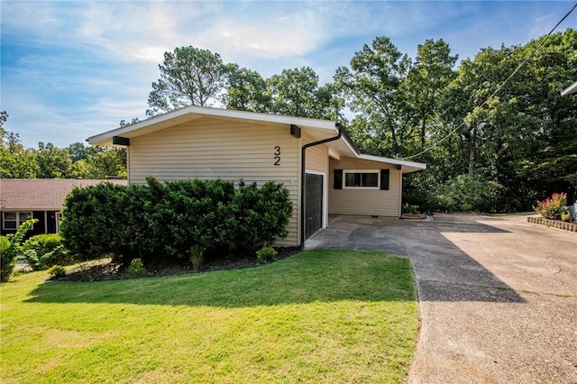 view of side of home featuring a yard