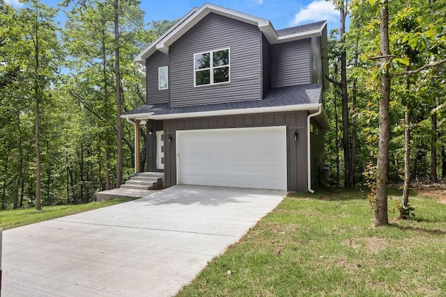 view of front facade with a garage and a front lawn