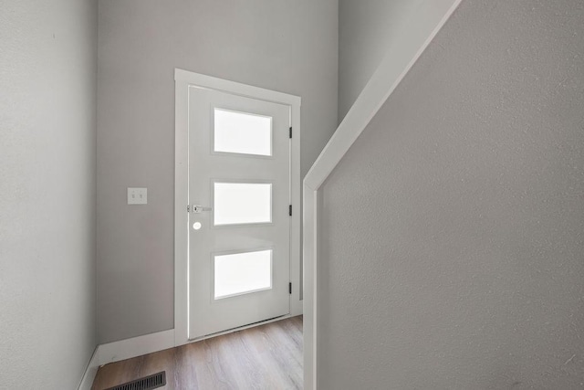 entrance foyer with light hardwood / wood-style flooring