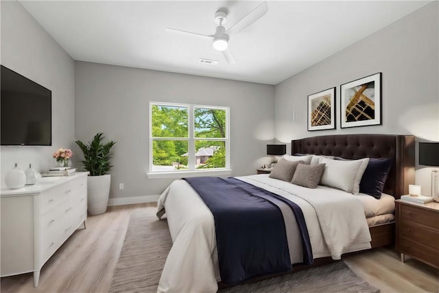 bedroom featuring light hardwood / wood-style floors and ceiling fan