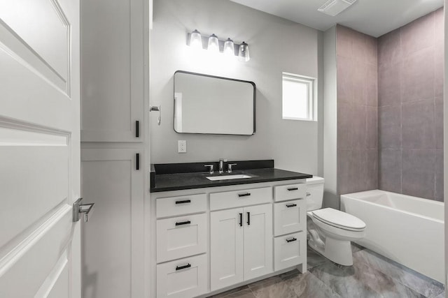 full bathroom with vanity, toilet, and tiled shower / bath