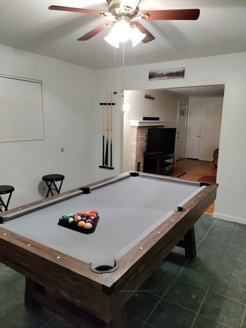 playroom with dark tile patterned flooring, ceiling fan, and billiards