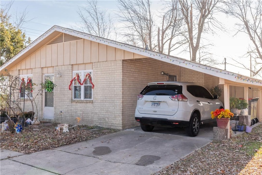 view of side of home featuring a carport