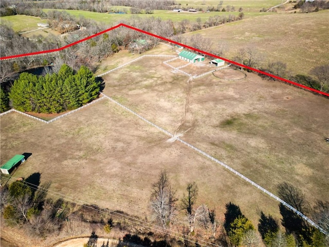 birds eye view of property with a rural view