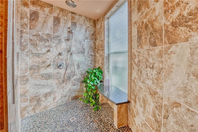 bathroom featuring tiled shower