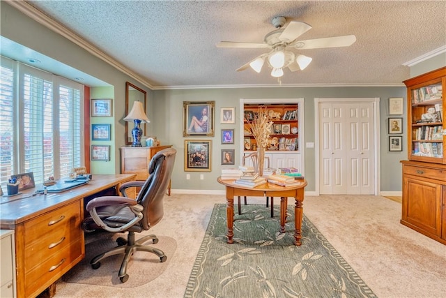 home office featuring a textured ceiling, light colored carpet, ceiling fan, and crown molding