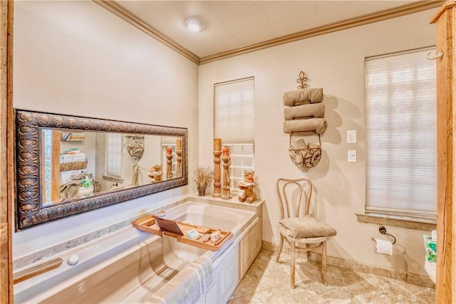 bathroom with ornamental molding and a tub