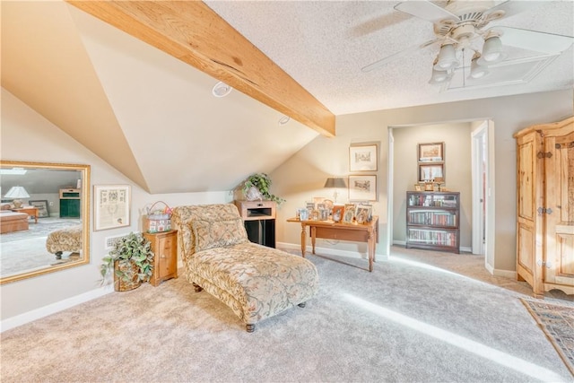 living area featuring carpet flooring, ceiling fan, lofted ceiling with beams, and a textured ceiling