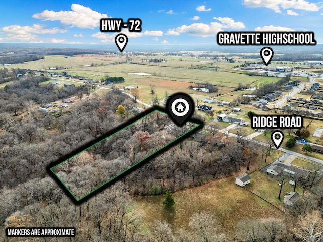 birds eye view of property with a rural view