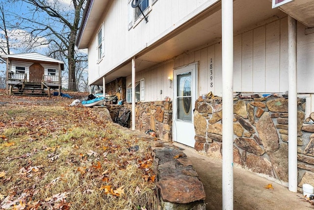 view of side of property with stone siding