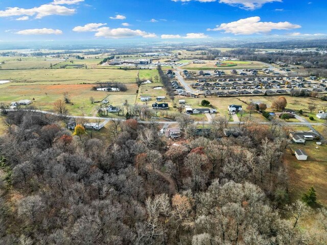 birds eye view of property featuring a rural view