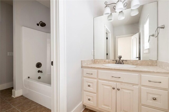3706 Cherokee Rd, Rogers, AR 72758 - full bath featuring tile patterned flooring, baseboards, bathing tub / shower combination, and vanity